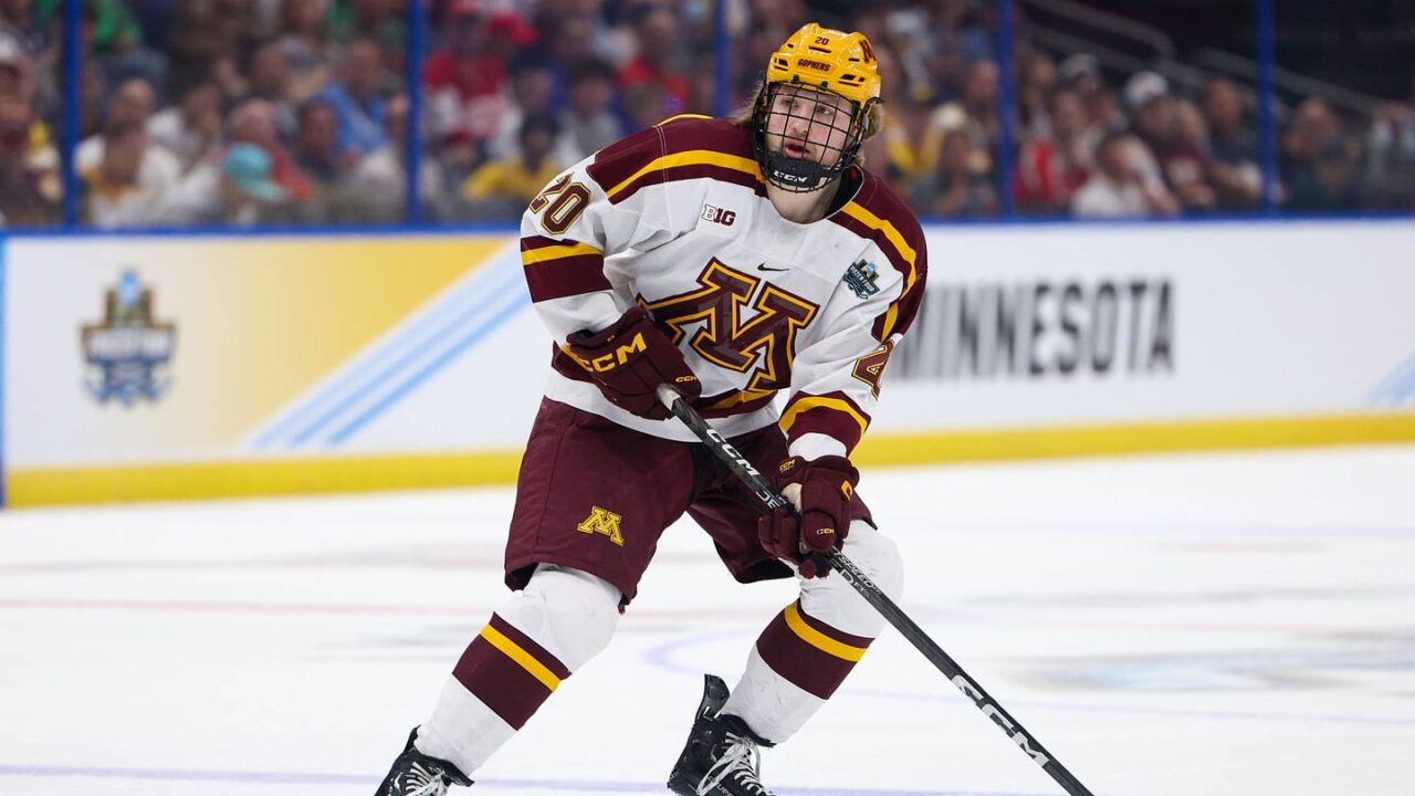 Apr 6, 2023; Tampa, Florida, USA; Minnesota defenseman Luke Mittelstadt (20)controls the puck against Boston University in the first period in the semifinals of the 2023 Frozen Four college ice hockey tournament at Amalie Arena. Mandatory Credit: Nathan Ray Seebeck-USA TODAY Sports