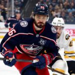 Apr 12, 2026; Columbus, Ohio, USA; Columbus Blue Jackets right wing Kirill Marchenko (86) and Boston Bruins defenseman Jonathan Aspirot (45) skate after a loose puck during the first period at Nationwide Arena. Mandatory Credit: Russell LaBounty-Imagn Images