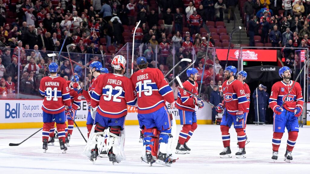 Jan 7, 2026; Montreal, Quebec, CAN; Montreal Canadiens players including goalies Jacob Fowler (32) and Jakub Dobes (75) celebrates the win against the Calgary Flames at the Bell Centre. Mandatory Credit: Eric Bolte-Imagn Images