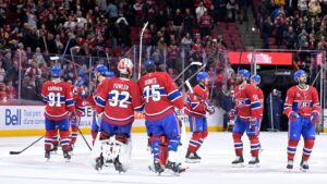 Jan 7, 2026; Montreal, Quebec, CAN; Montreal Canadiens players including goalies Jacob Fowler (32) and Jakub Dobes (75) celebrates the win against the Calgary Flames at the Bell Centre. Mandatory Credit: Eric Bolte-Imagn Images