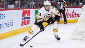 Mar 17, 2026; Montreal, Quebec, CAN; Boston Bruins defenseman Charlie McAvoy (73) plays the puck against the Montreal Canadiens during the third period at Bell Centre. Mandatory Credit: David Kirouac-Imagn Images