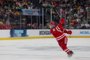 Wisconsin Badgers defenceman Aiden Dubinsky follows through on a shot during an NCAA semifinal game against the North Dakota Fighting Hawks on April 9 at T-Mobile Arena in Las Vegas.