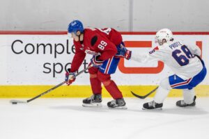 Owen Protz, right, skates after defenceman Tim Runtso,left, during development camp in Brossard this past July.