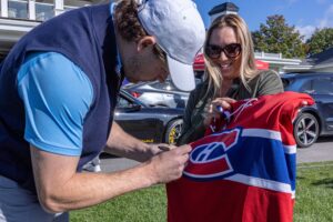 Canadiens winger Josh Anderson signs a sweater for Katsy Turner before the team's annual golf tournament at Laval-sur-le-Lac on Monday.