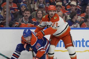 Edmonton Oilers Leon Draisaitl (29) is pushed to the ice by Anaheim Ducks Chris Kreider (20) during the second period of game 5 in the first round of an NHL hockey Stanley Cup playoff series on Tuesday, April 28, 2026 in Edmonton. Greg Southam-Postmedia